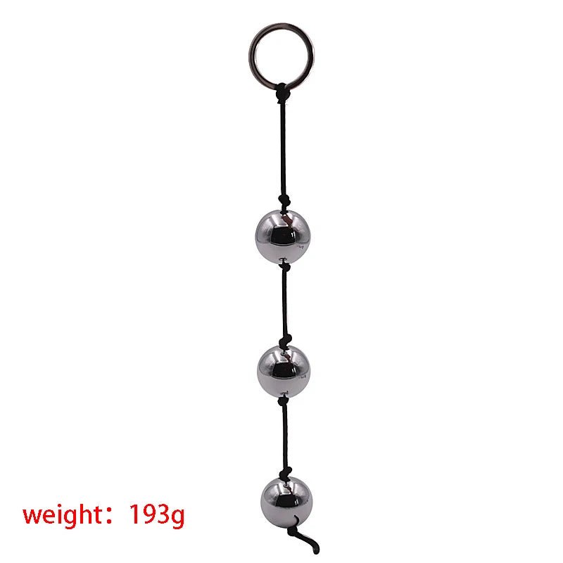 Kegel trainer showing attachment cord or retrieval string
