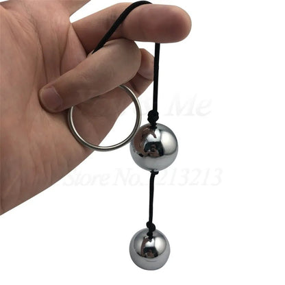 Kegel trainer showing attachment cord or retrieval string