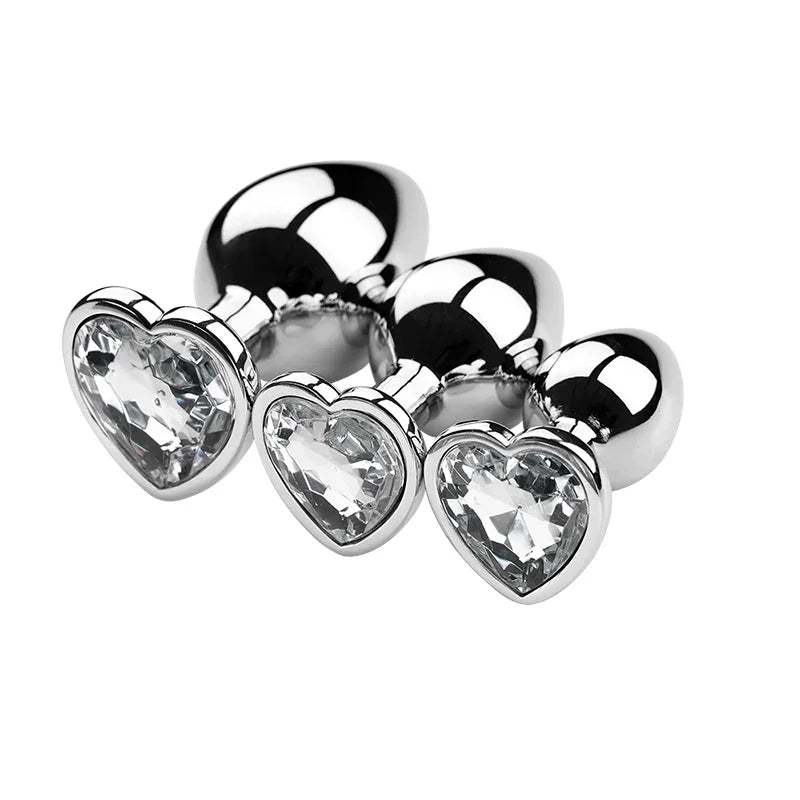 Three crystal plugs arranged in size order with coloured bases