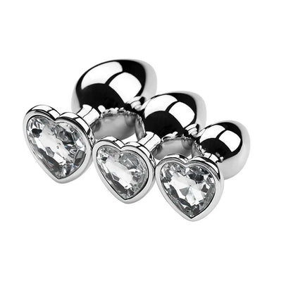 Three crystal plugs arranged in size order with coloured bases