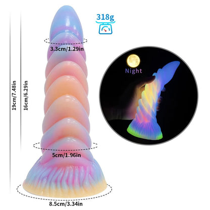 Close-up of control buttons or charging port on dark glowing toy for woman with suction cup fun play
