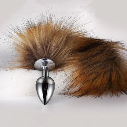 Close-up of fluffy fox tail attached to metal plug base