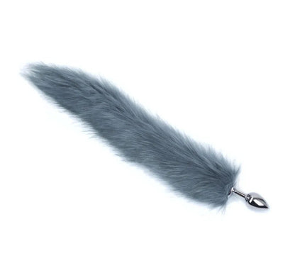 Fox tail plug beside scale reference