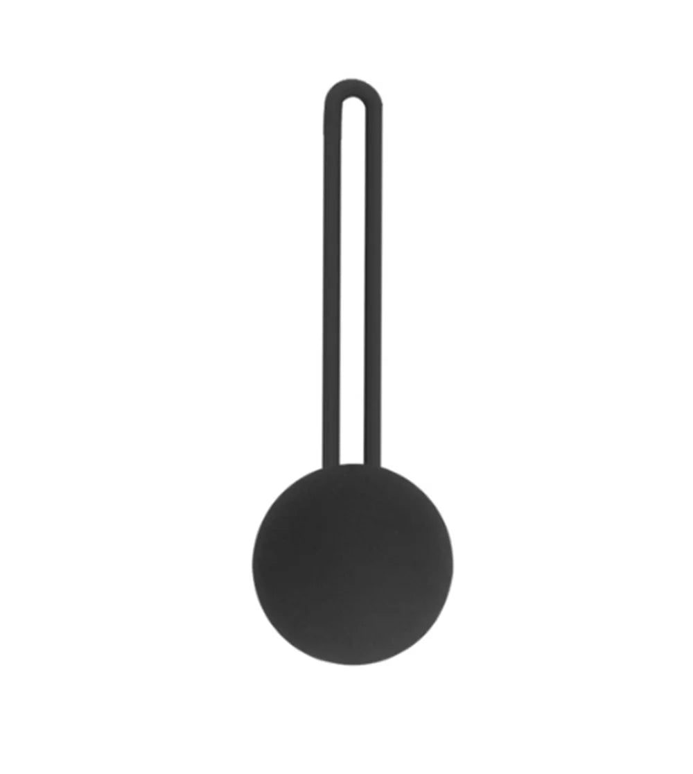 Kegel trainer showing attachment cord or retrieval string