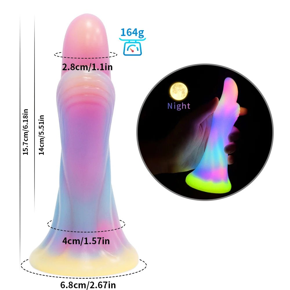 Close-up of control buttons or charging port on dark glowing toy for woman with suction cup fun play