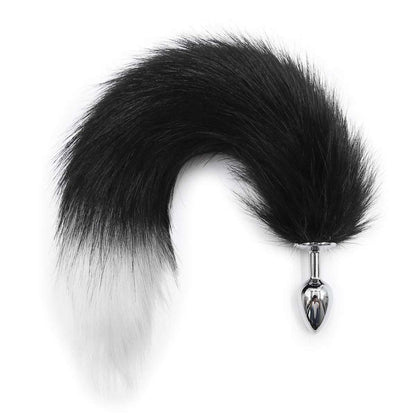 Small fox tail plug beside ruler for scale