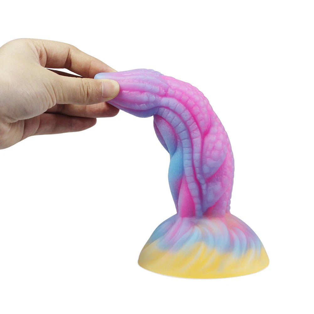 Size comparison of dark glowing toy for woman with suction cup fun play with scale reference