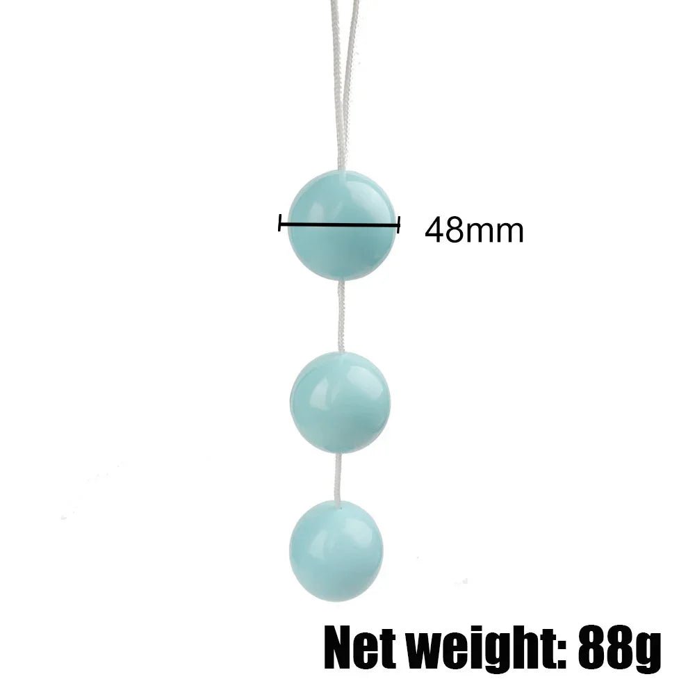 Kegel trainer showing attachment cord or retrieval string