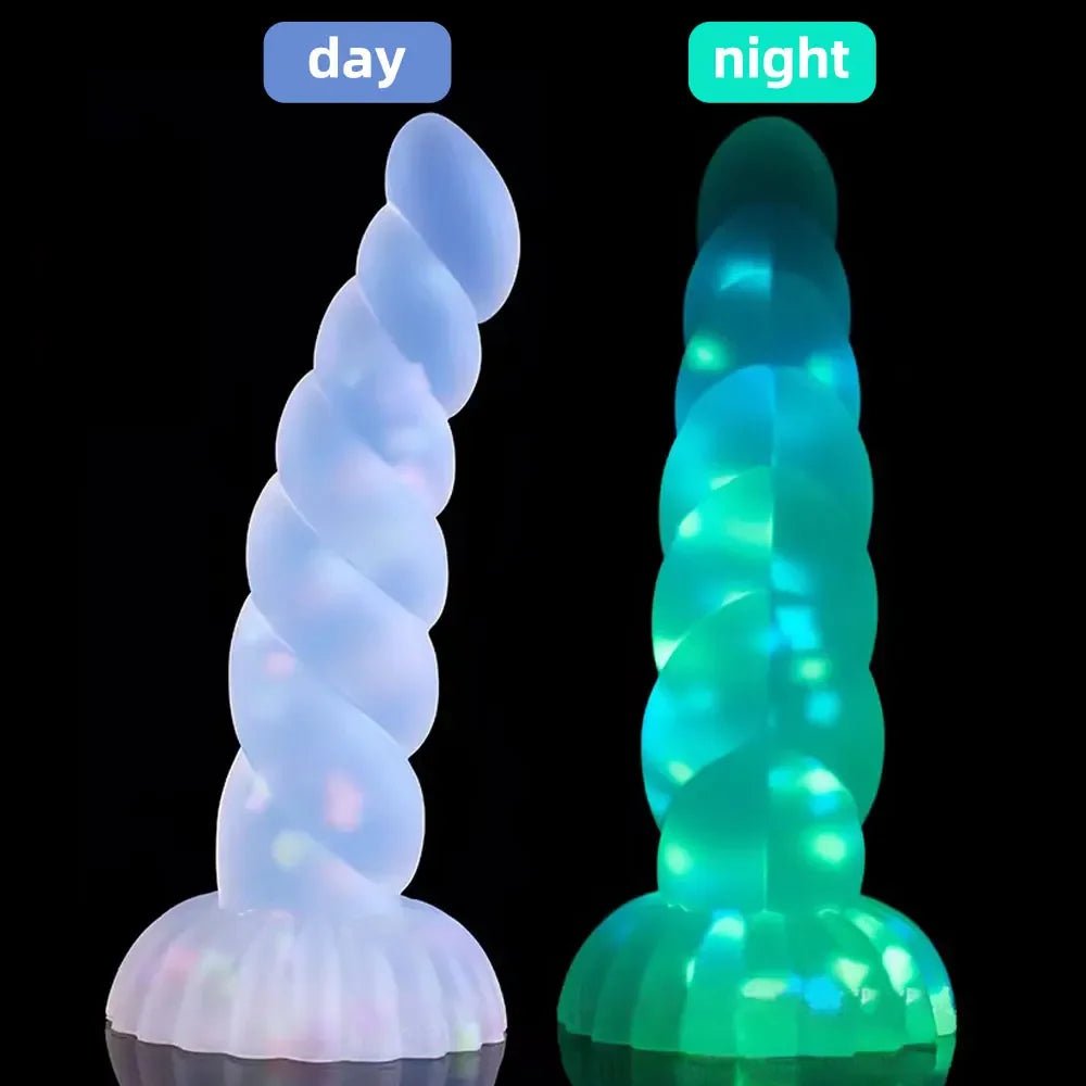 Front view of dark glowing toy for women with suction cup for pleasure on white background