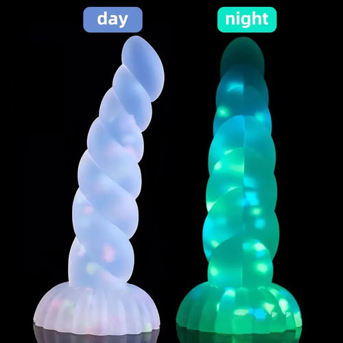 Front view of dark glowing toy for women with suction cup for pleasure on white background