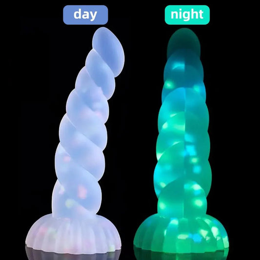Front view of dark glowing toy for women with suction cup for pleasure on white background
