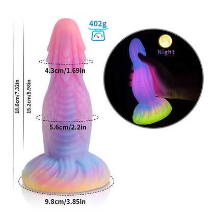 Packaging and accessories included with dark glowing toy for woman with suction cup fun play