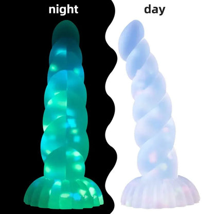 Close-up of material texture and finish on dark glowing toy for women with suction cup for pleasure