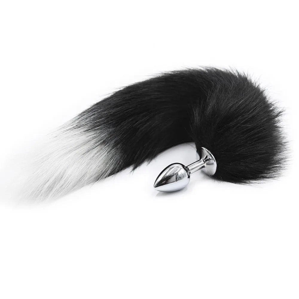 Close-up of fluffy fox tail on small metal plug