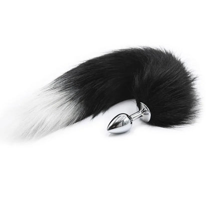 Close-up of fluffy fox tail on small metal plug