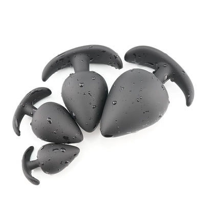 Side profile of large silicone plug showing tapered shape