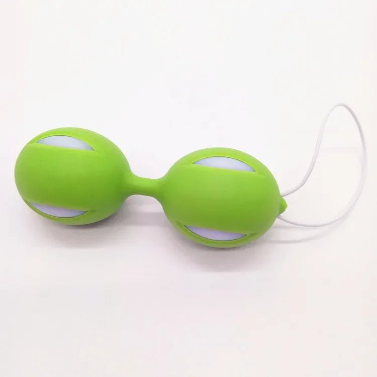 Kegel trainer showing attachment cord or retrieval string